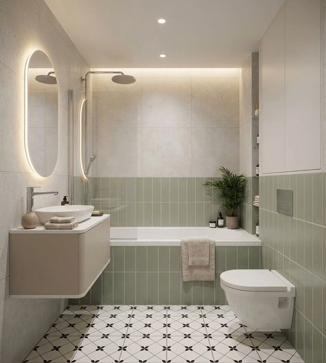 Sage green subway tiles in herringbone pattern covering bathroom shower walls above terrazzo floor in a Virginia-Highland home